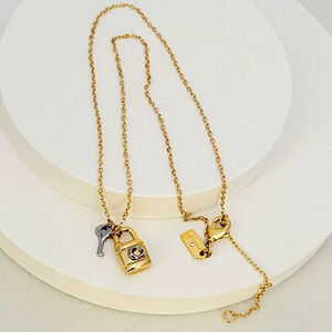 Coach Gold Silver Mixed Lock and Key Pendant Necklace